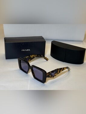 Prada Women’s Black Front Tortoiseshell Temple Sunglasses with Purple Lenses